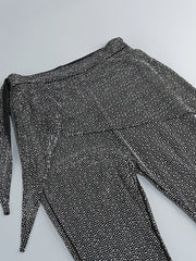 Black and white patterned pants on a light gray background