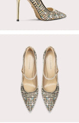 Pair of pointed-toe high-heeled shoes with tweed pattern on a light background