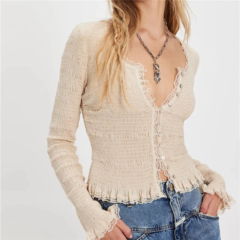 Beige lace-up top worn by a person on a plain background