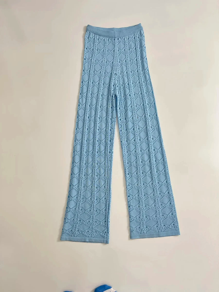 Light blue lace pants on a beige background