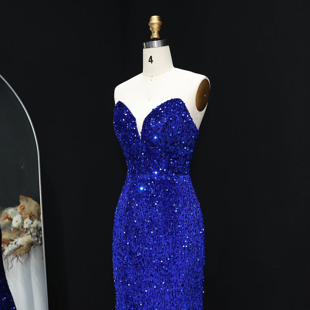 Blue sequin dress on a mannequin against a black background