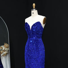 Blue sequin dress on a mannequin against a black background