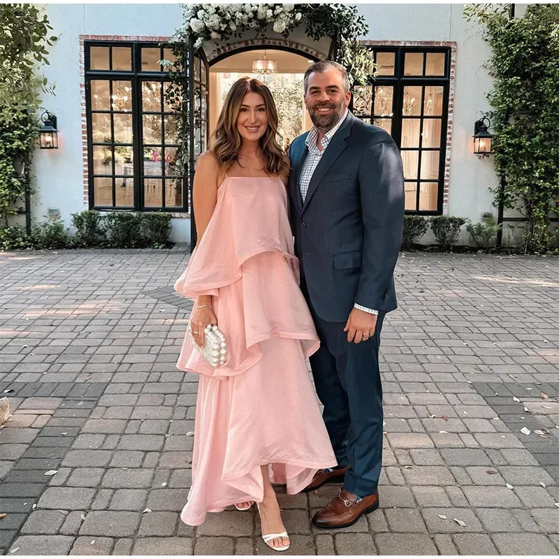 Strapless ruffle maxi dress worn by a couple