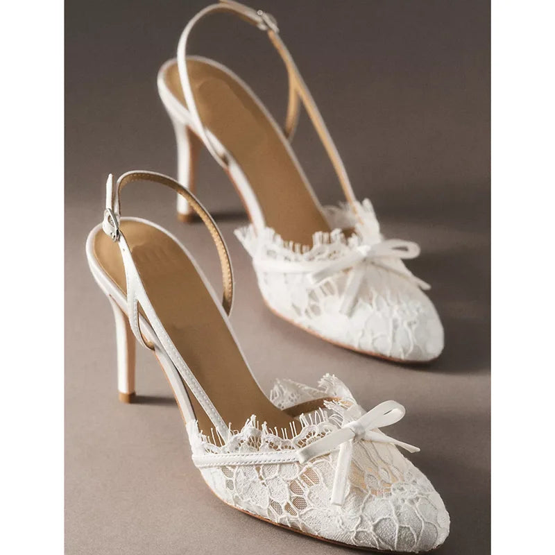 White lace slingback heels with butterfly knot detail