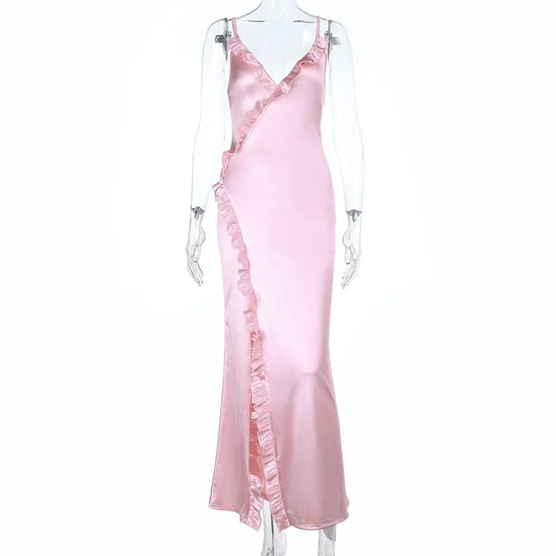 Pink satin slip dress on a mannequin against a white background