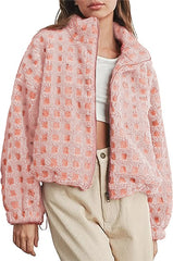 Person wearing a pink textured jacket with a white background