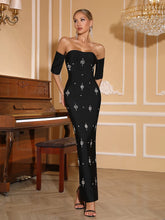 Off-shoulder diamond bandage maxi evening gown.