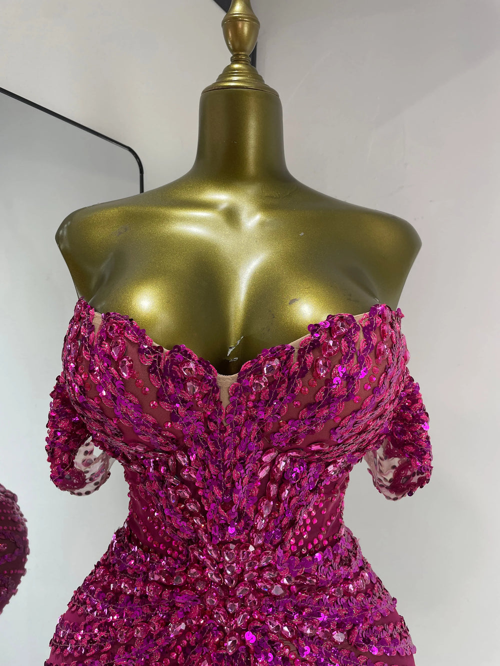 Sequin off-shoulder mini dress neckline detail