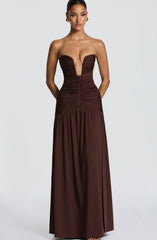 Brown strapless gown with a deep neckline on a white background