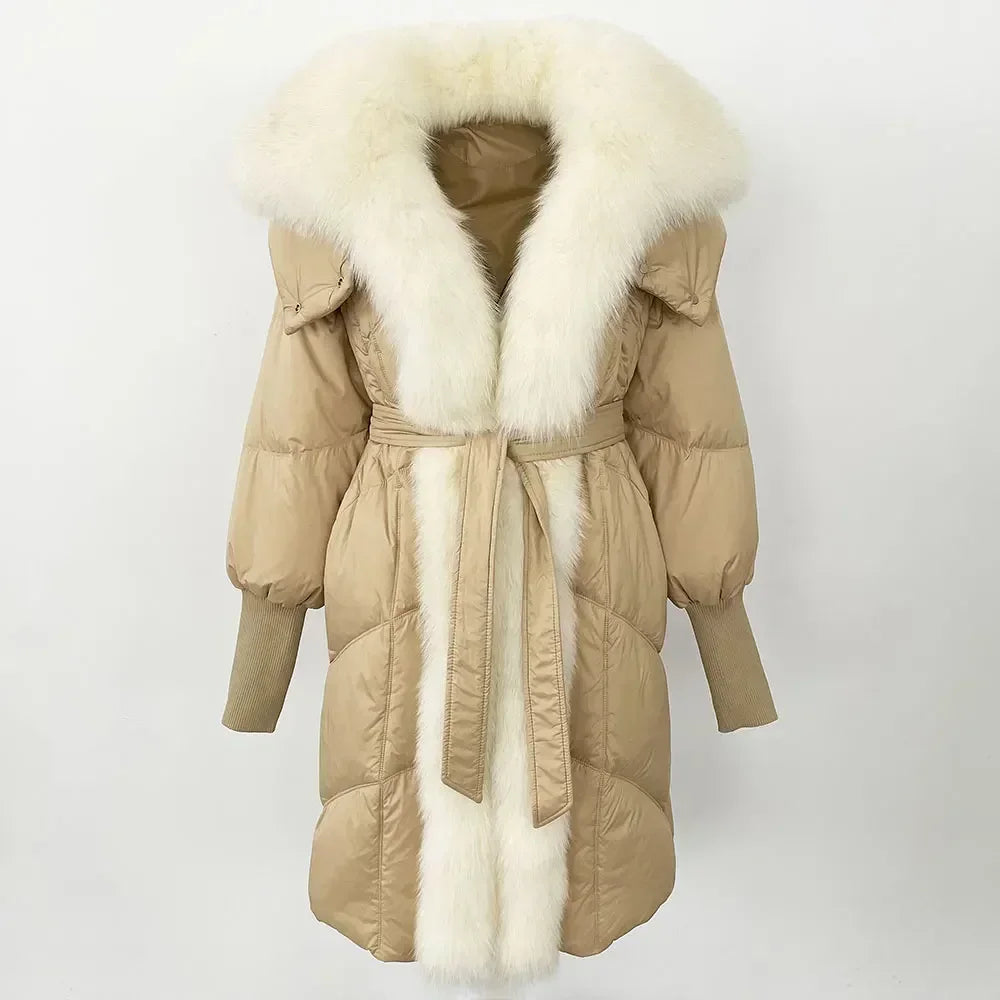 Beige winter coat with white fur trim on a light gray background