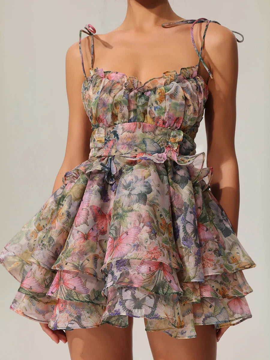 Floral dress with ruffled layers on a plain background