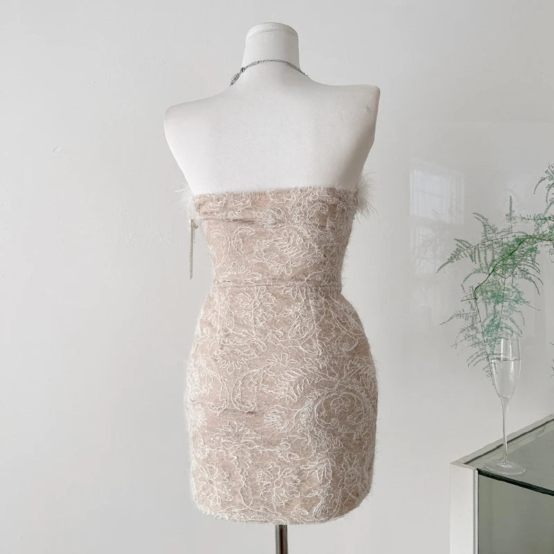 Feather trimmed pearl embellished corset mini dress back view