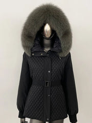 Black quilted coat with large fur hood on a mannequin against a white background