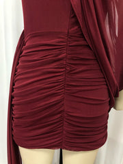 Maroon ruched dress on a mannequin against a white background