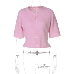 Pink short-sleeve cardigan on a mannequin against a white background