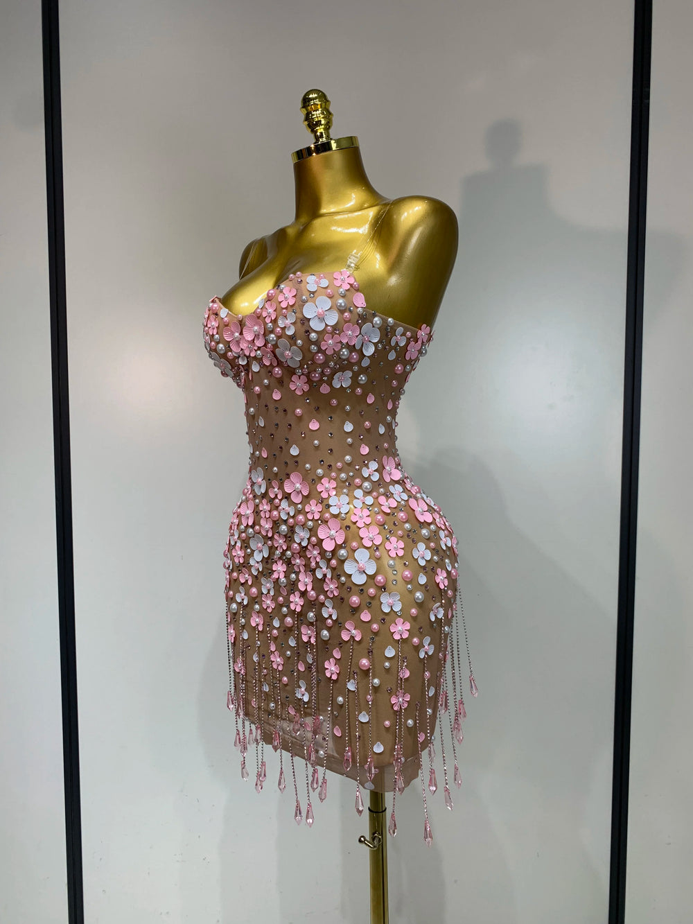 Appliqued flower mini dress, side view.