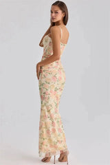 Back view of a floral print mesh corset maxi dress