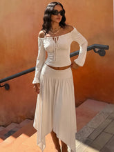 White off shoulder long sleeve crop top and asymmetrical hem midi skirt two-piece set