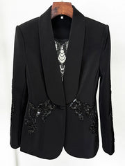 Black blazer with sequin embellishments on a white background