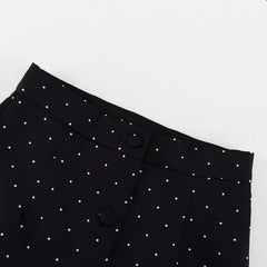 Black pants with white polka dots
