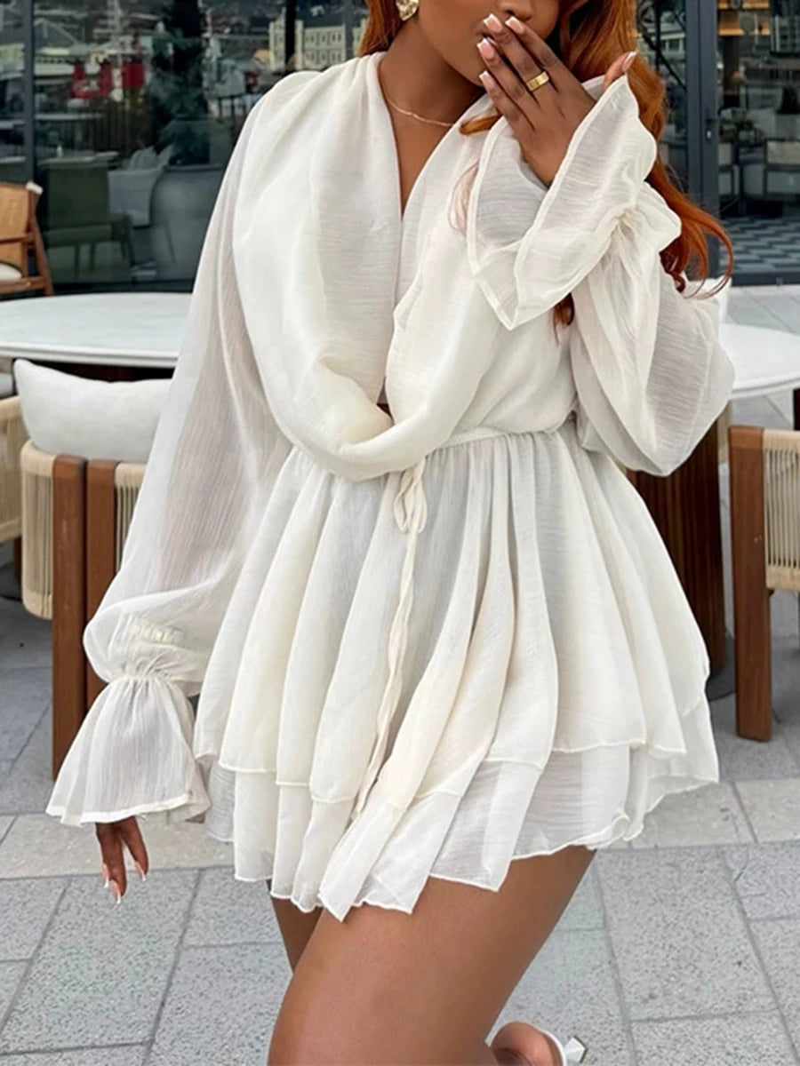 Close-up of the V-neck and ruffle sleeve detail on a mini dress
