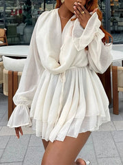 Close-up of the V-neck and ruffle sleeve detail on a mini dress
