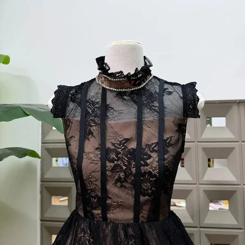 Close-up of black lace stand collar mini dress neckline
