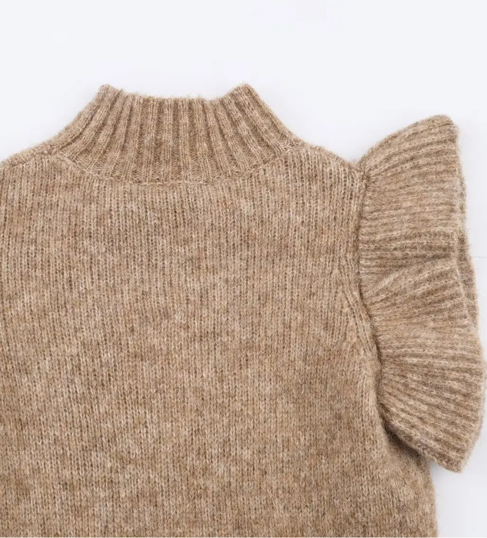 Beige sweater with ruffled sleeves on a white background
