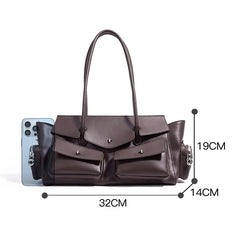 Brown handbag with measurements on a white background
