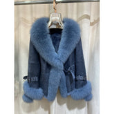 Blue shearling jacket with a prominent blue fox fur collar and cuffs.