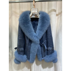 Blue shearling jacket with a prominent blue fox fur collar and cuffs.