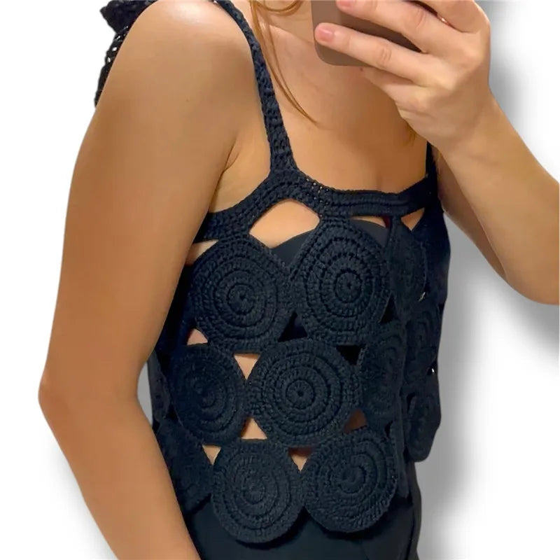 Close-up of black crochet circular patchwork knit crop tank top
