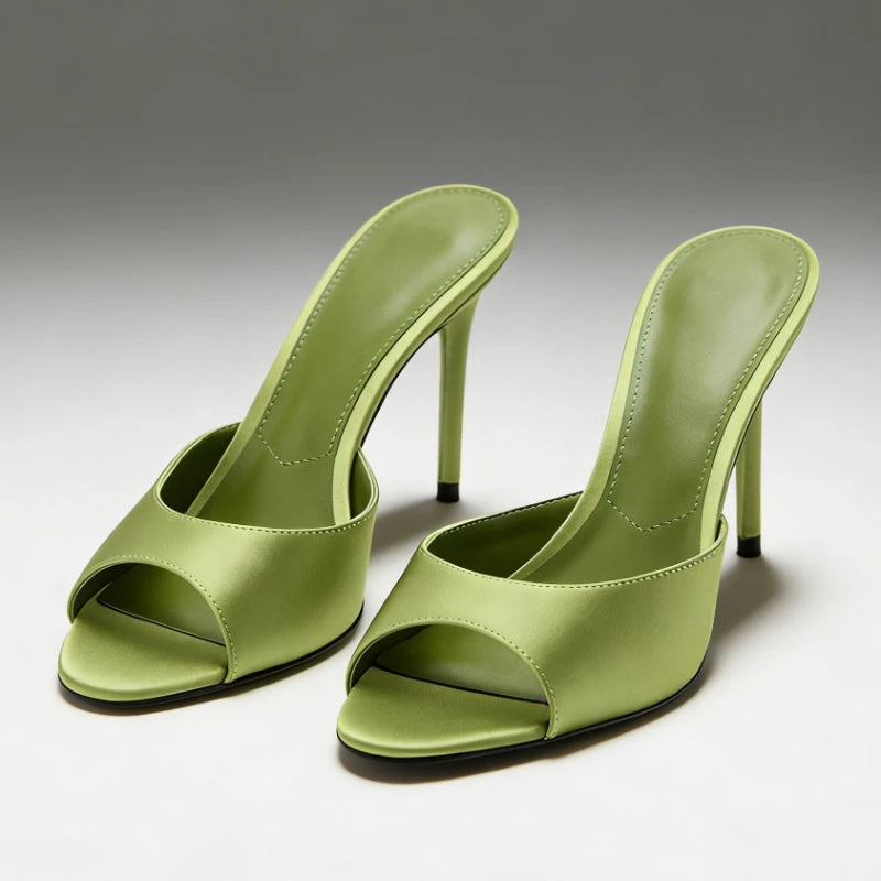 Pair of green satin stiletto heel mules