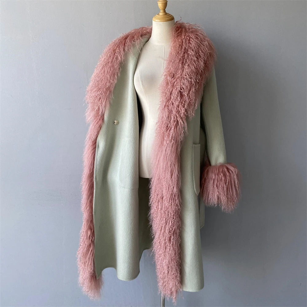 Green coat with pink fur trim on a mannequin against a gray background