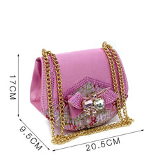 Pink handbag with gold chain and measurements on a white background