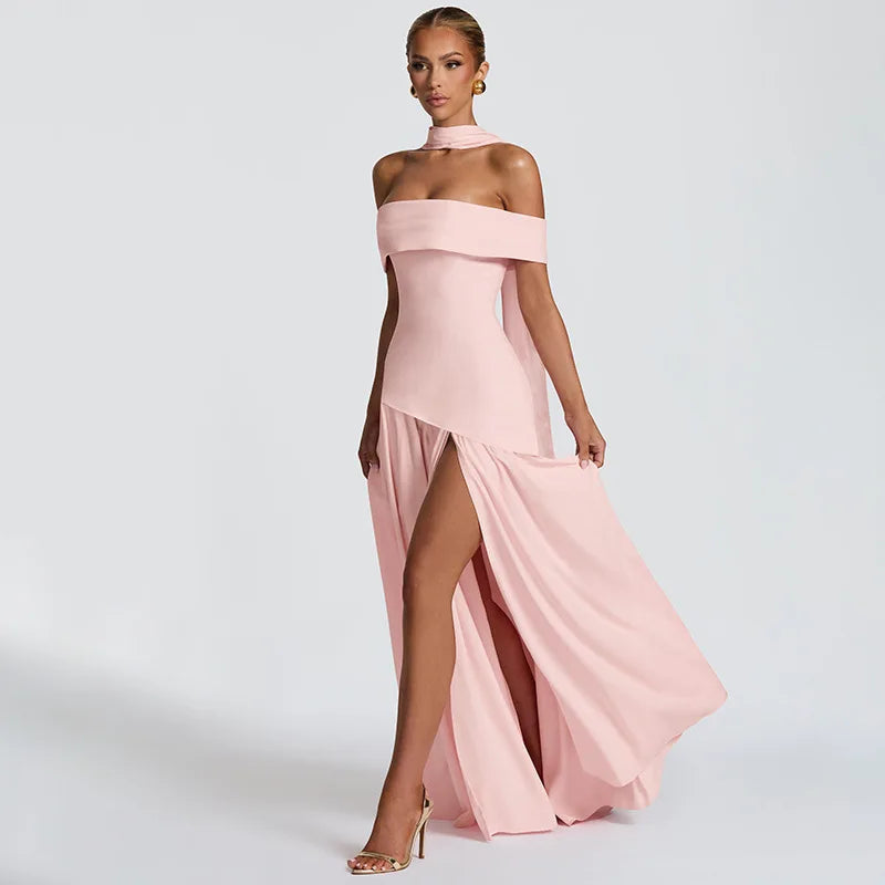 Woman wearing a pink off-shoulder gown with a high slit