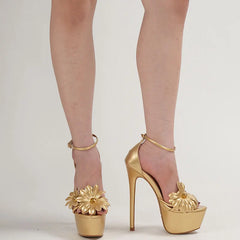 Gold high-heeled shoes with floral designs