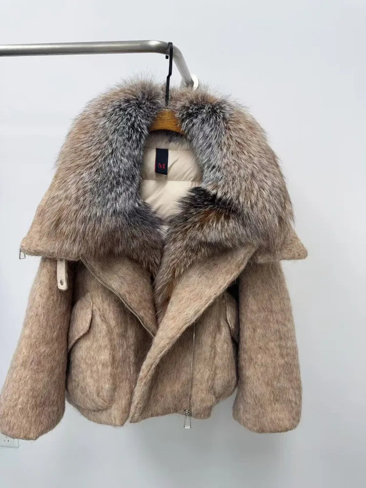 Beige coat with fur hood on a white background