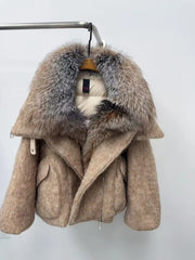 Beige coat with fur hood on a white background