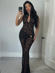 Model wearing a black lace mock neck halter jumpsuit with flared legs.