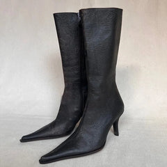 Black pointed toe boots with stiletto heel
