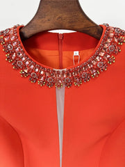 Close-up of beaded neckline on cap sleeve mini dress