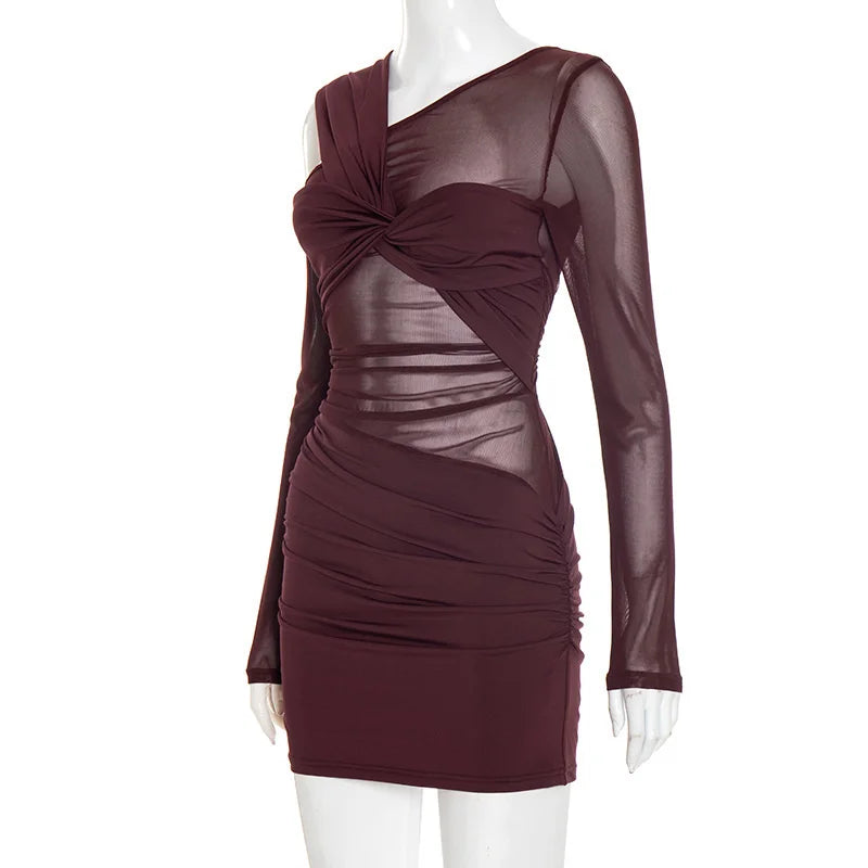 Mauve dress with sheer panels on a white background