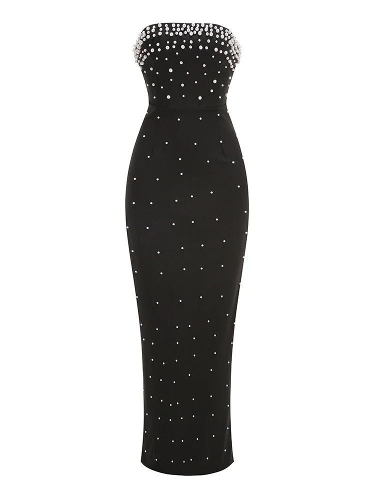 Black strapless dress with white bead embellishments on a white background