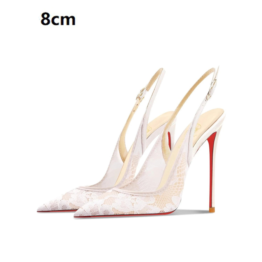 White high-heeled shoes with red soles on a white background
