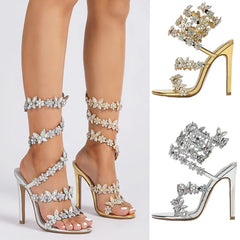 Elegant high-heeled sandals with crystal embellishments on a white background
