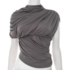 Gray draped top on a mannequin against a white background