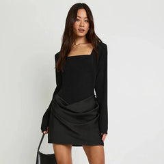 Elegant mini dress styled with subtle sculpted structure