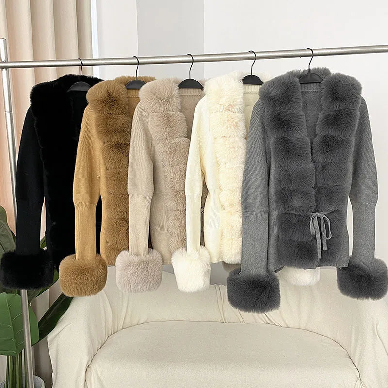 Row of fur vests on a rack against a white curtain background