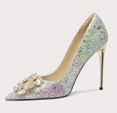 High-heeled shoe with glittery design and decorative element on a light gray background